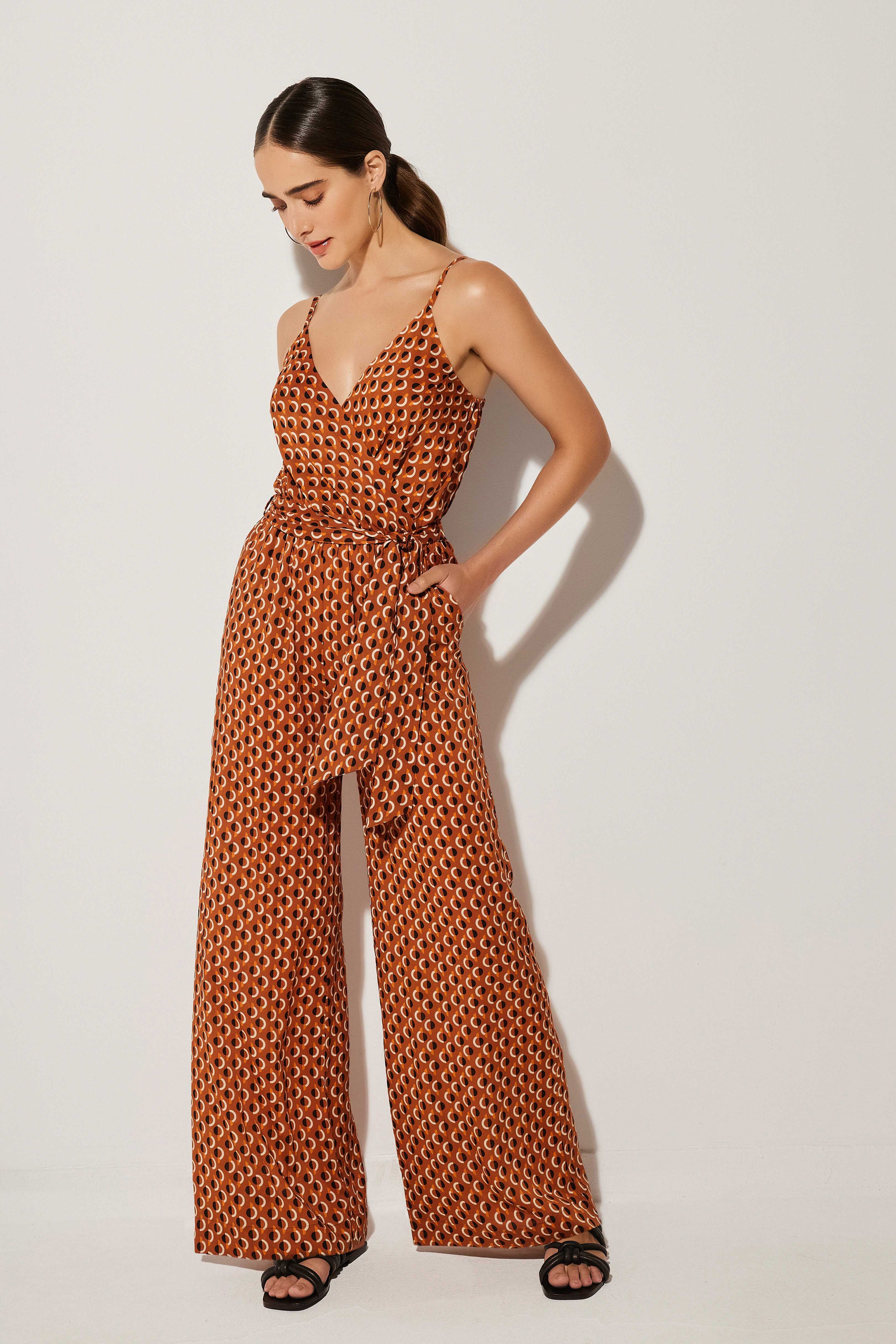 Model wearing orange jumpsuit