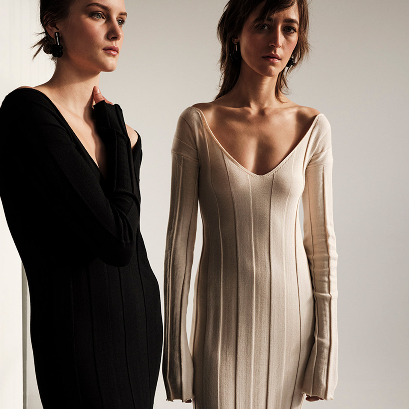 Two models wearing Urban Reset dresses by Kourbela