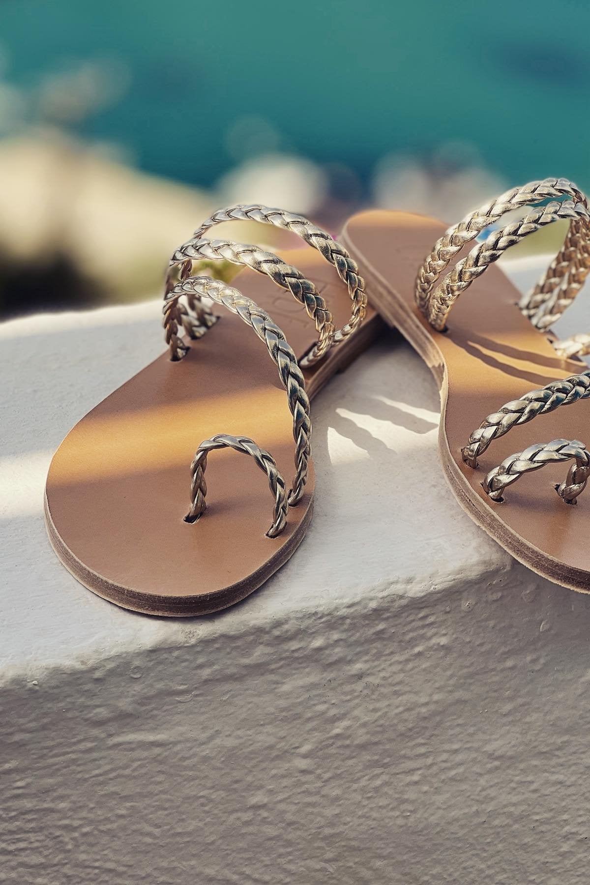 Shady closeup of toe hole on greek gold sandals